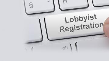 Computer keyboard with "Lobbyist Registration" button being pressed
